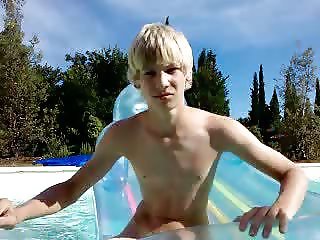 young teen boy naked swimming in pool