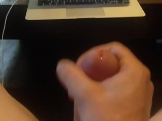 Stroking cock and watching porn