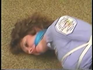 policewoman hogtied on floor